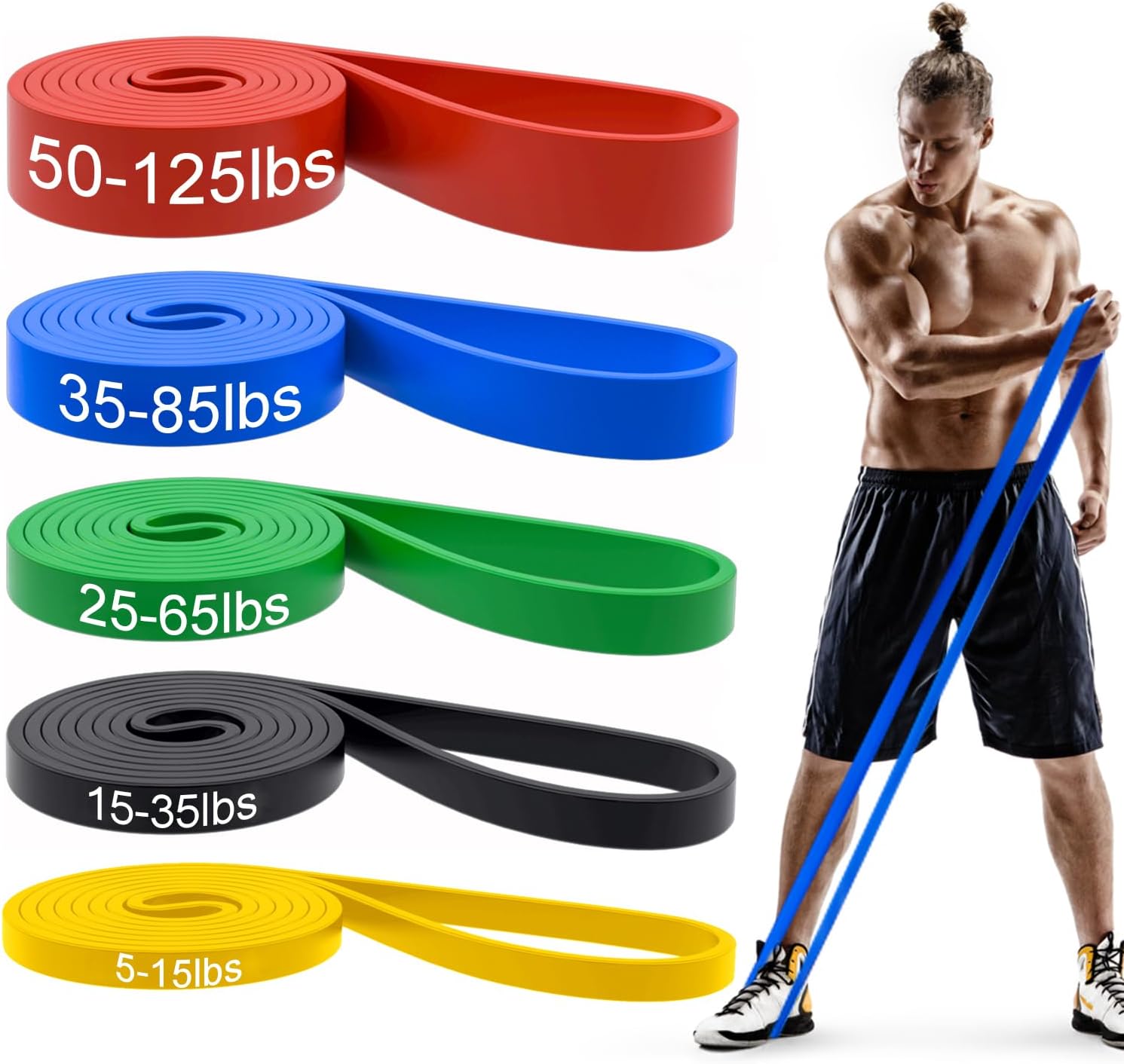 Set of four pull up resistance bands in different colors and thicknesses arranged on a yoga mat for workout demonstration.